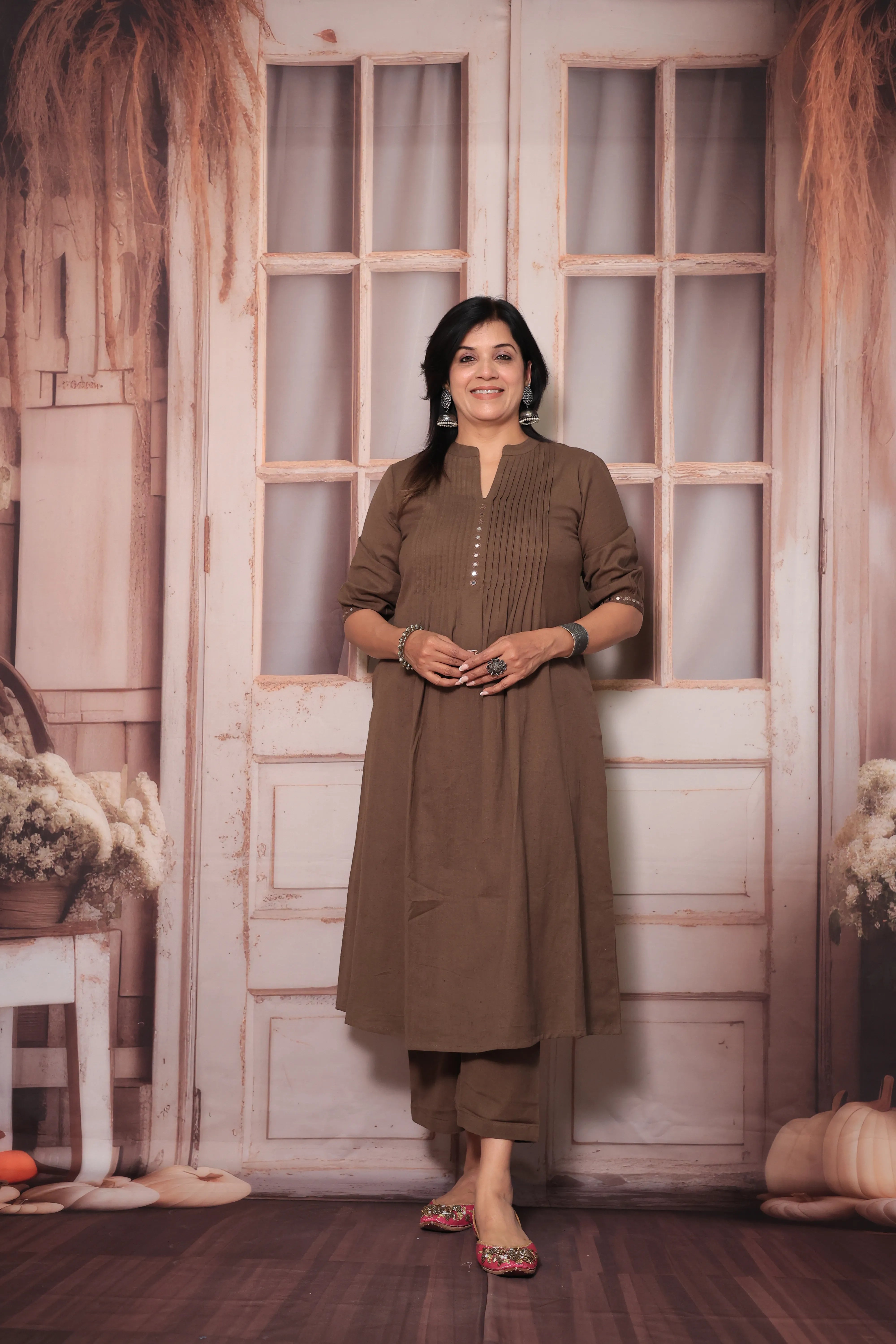 Brown A-Line Pleated Yoke Kurti Pant Set in Flex Cotton with Mirror Work for Women