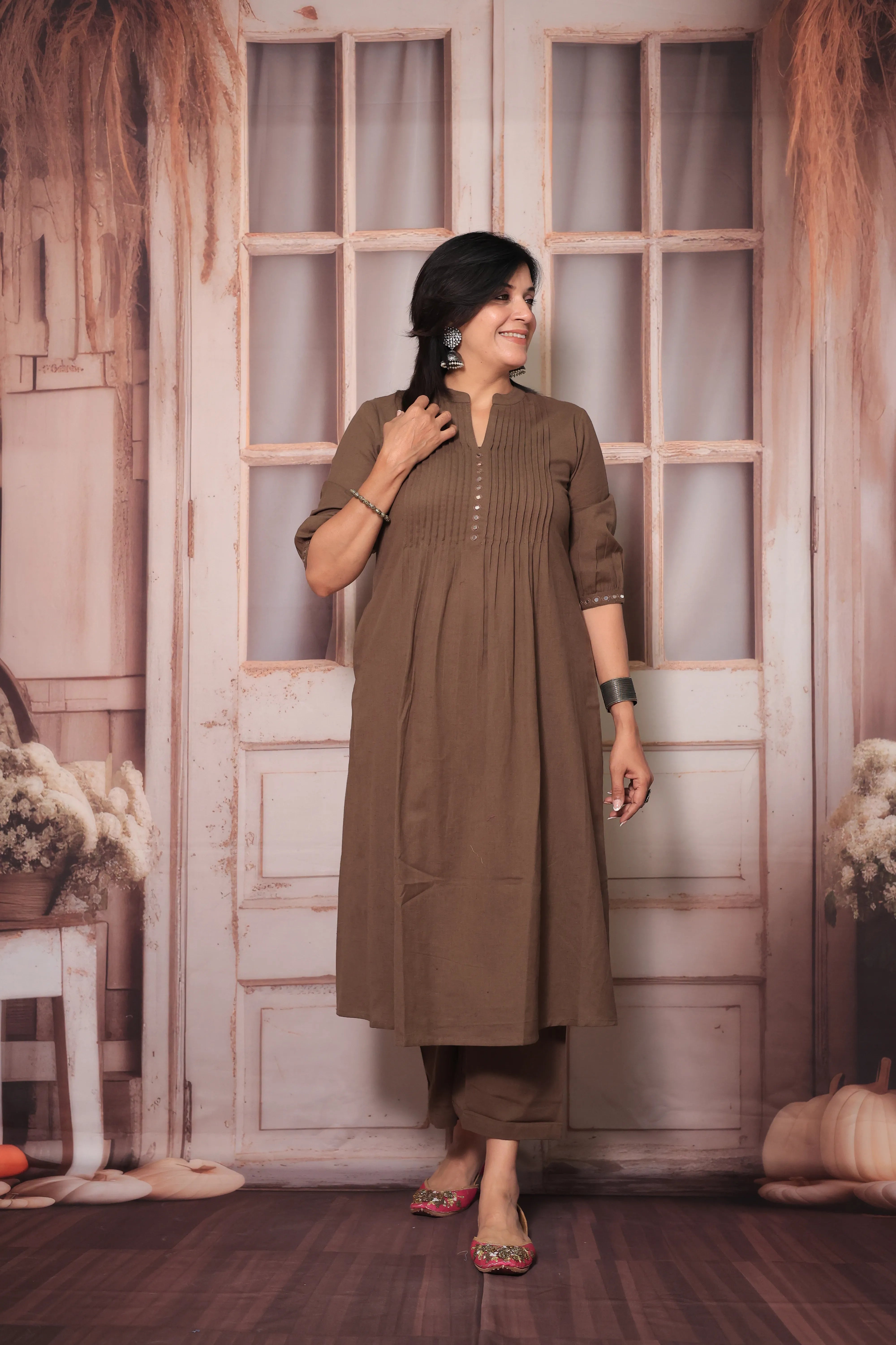 Brown A-Line Pleated Yoke Kurti Pant Set in Flex Cotton with Mirror Work for Women