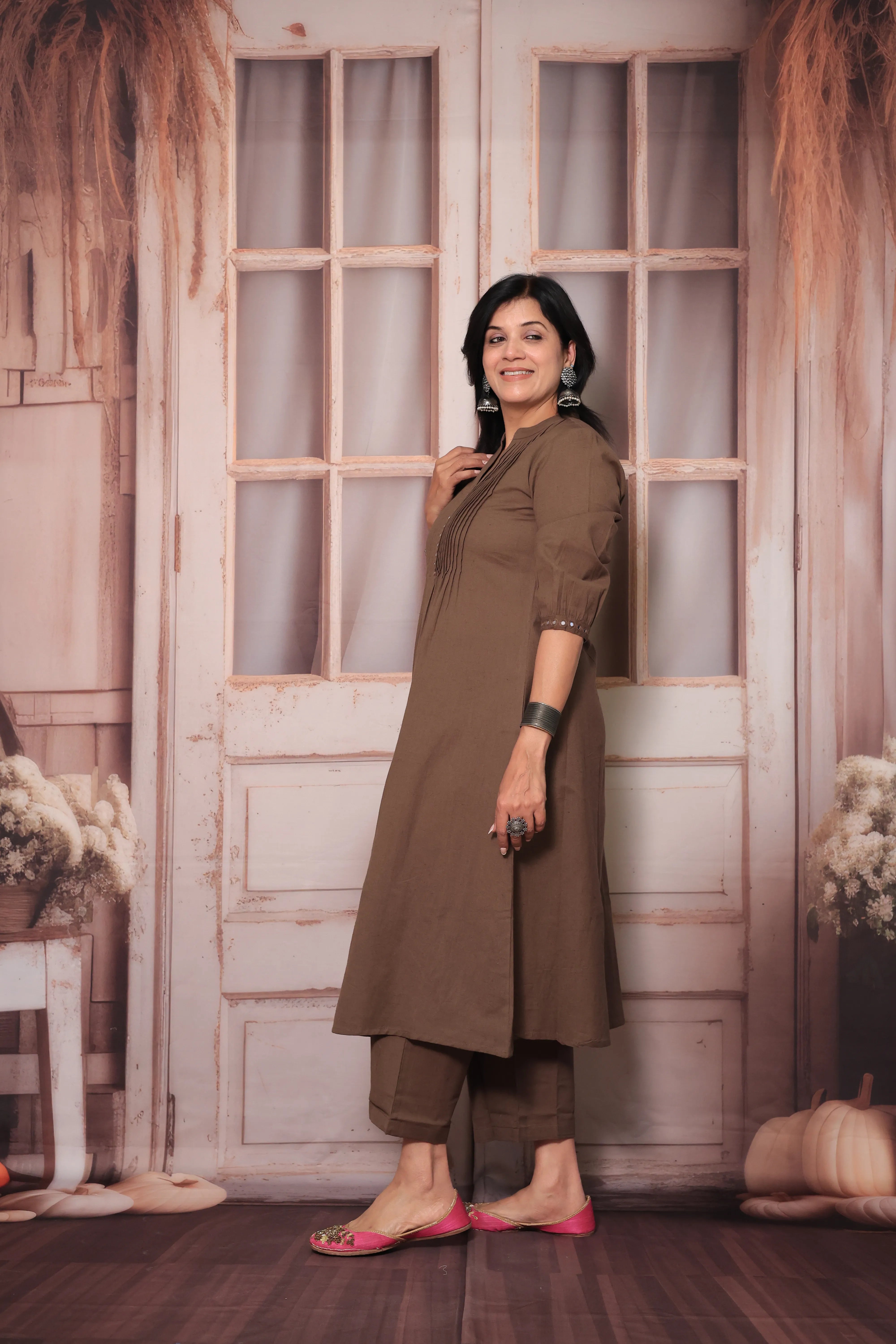 Brown A-Line Pleated Yoke Kurti Pant Set in Flex Cotton with Mirror Work for Women