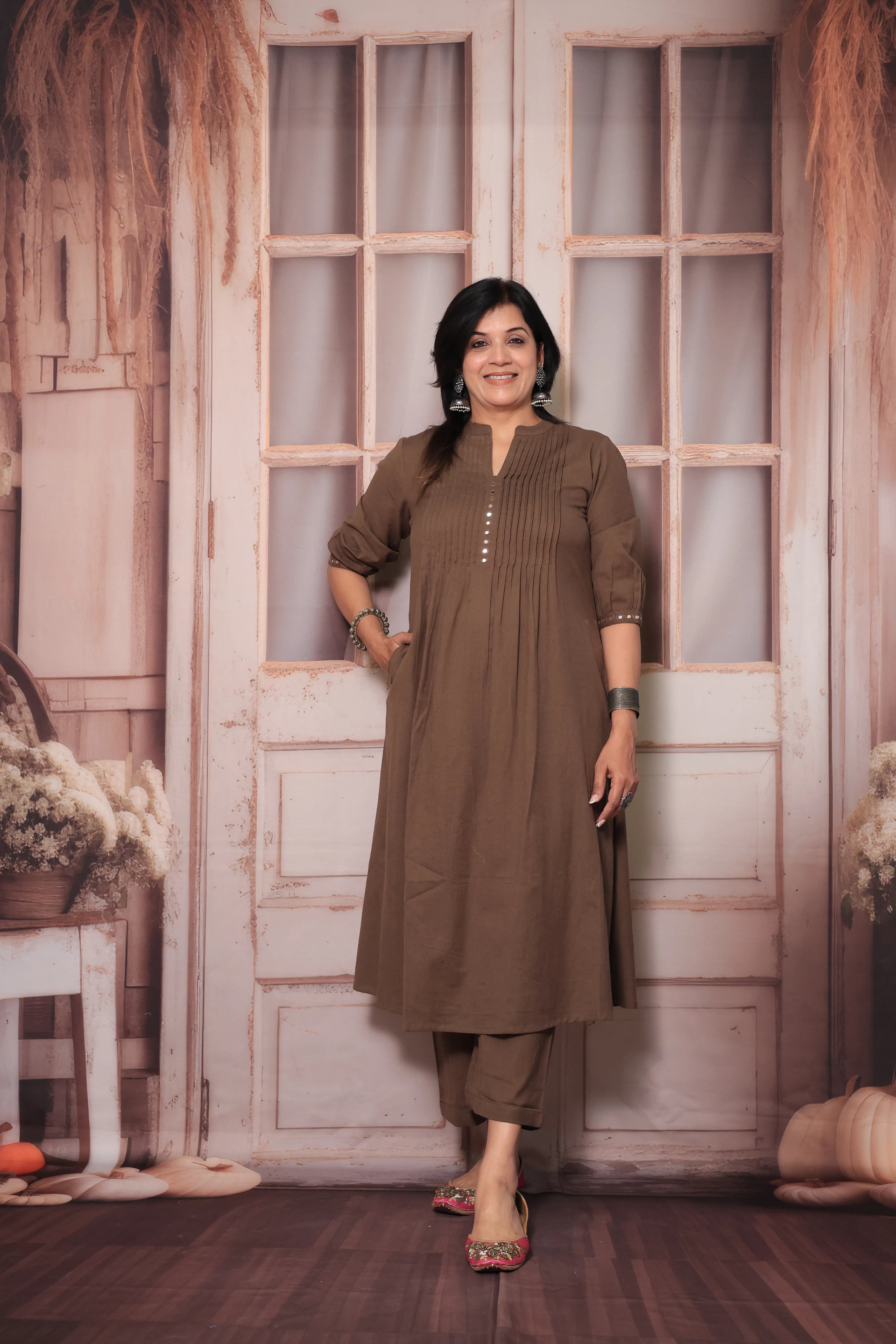 Brown A-Line Pleated Yoke Kurti Pant Set in Flex Cotton with Mirror Work for Women
