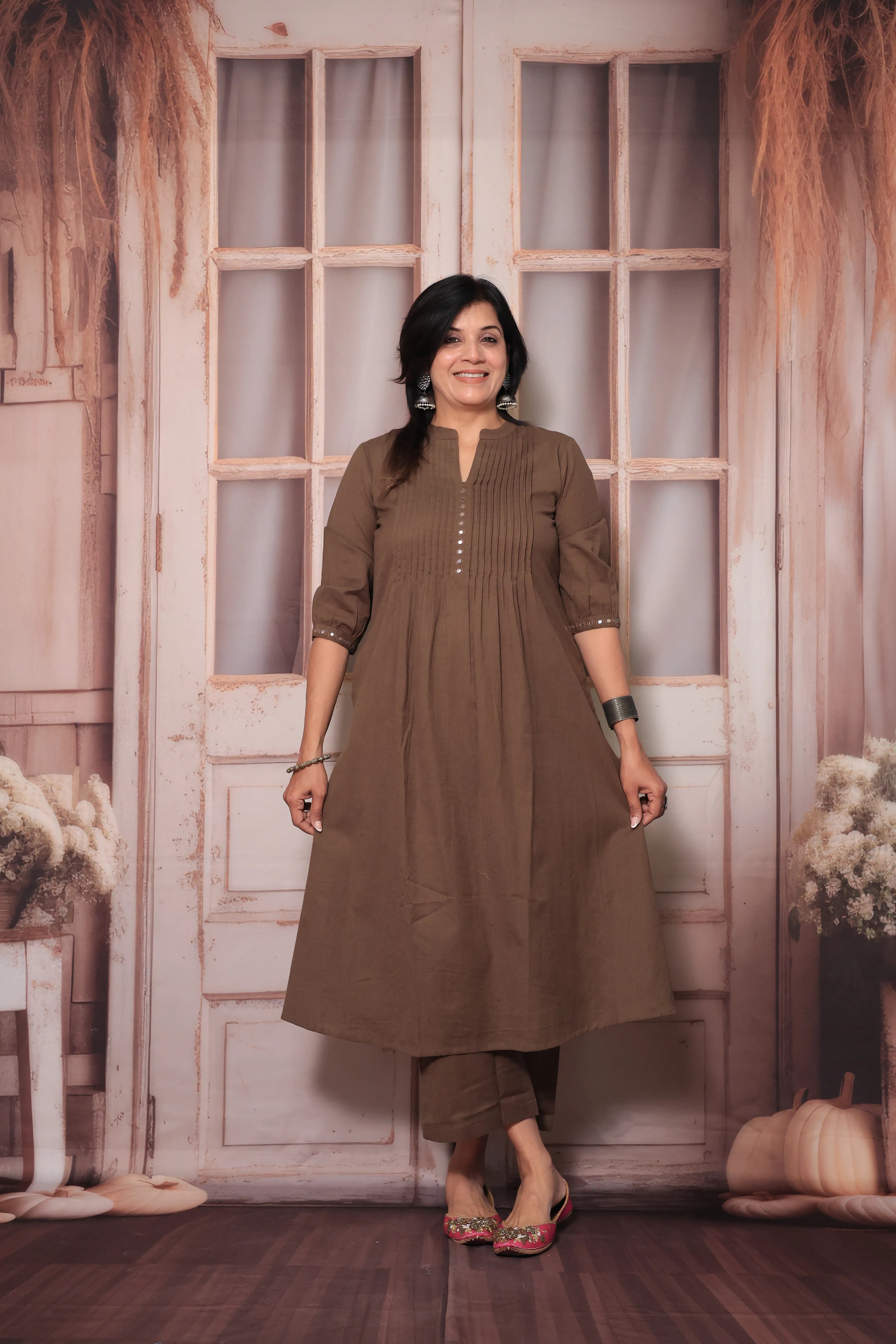 Brown A-Line Pleated Yoke Kurti Pant Set in Flex Cotton with Mirror Work for Women