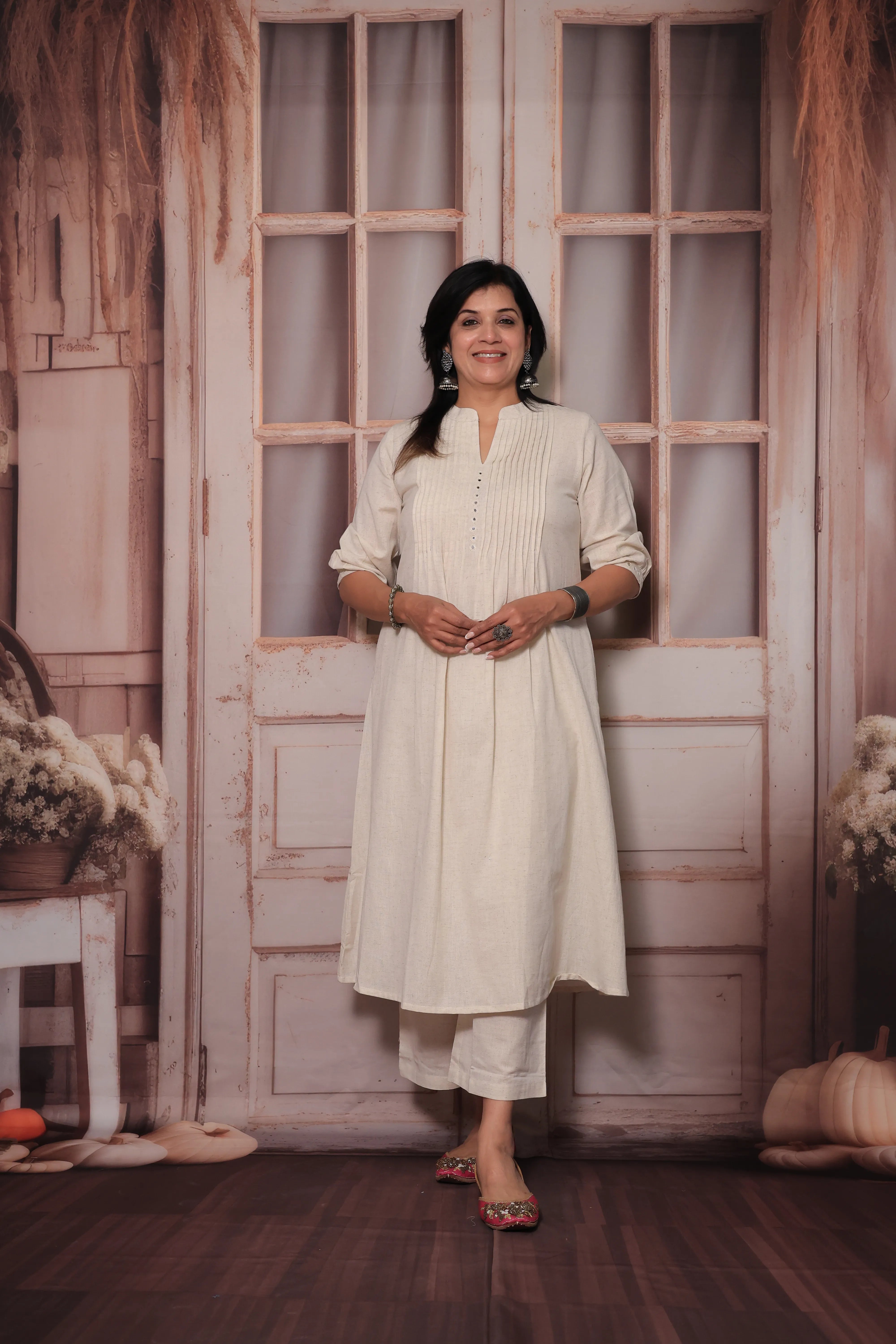 Off white A-Line Pleated Yoke Kurti Pant Set in Flex Cotton with Mirror Work for Women